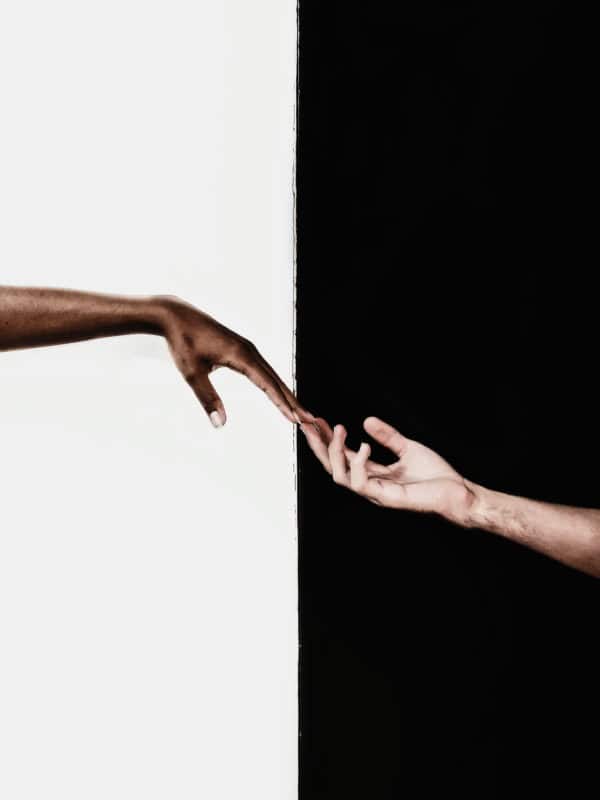 Hands in front of white and black background